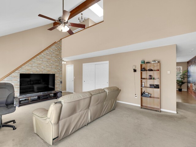 carpeted living area featuring high vaulted ceiling, baseboards, beamed ceiling, and ceiling fan