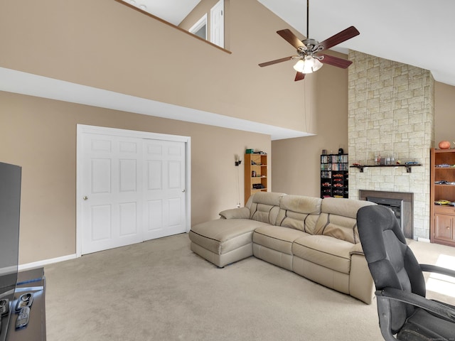 living room featuring high vaulted ceiling, carpet, a fireplace, and ceiling fan