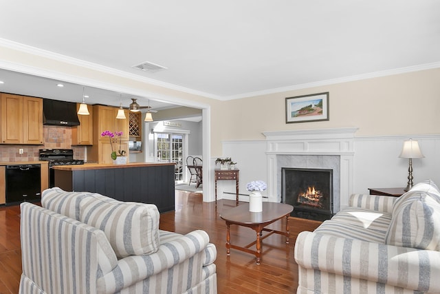 living area featuring a baseboard radiator, crown molding, a tiled fireplace, dark wood-style flooring, and visible vents