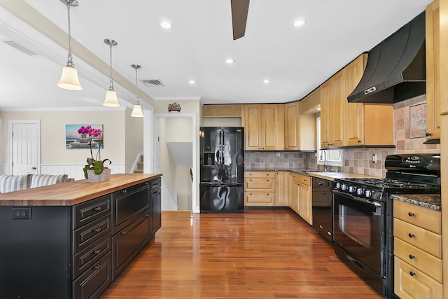 kitchen with ventilation hood, visible vents, crown molding, wooden counters, and black appliances