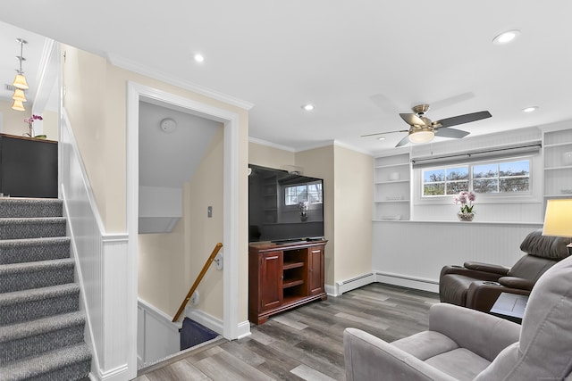 living area featuring a ceiling fan, recessed lighting, ornamental molding, and dark wood finished floors