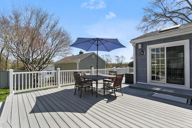 deck with outdoor dining area