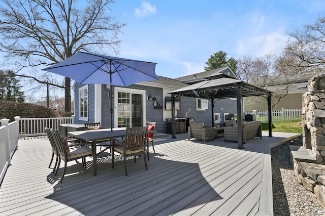 wooden terrace featuring a gazebo, an outdoor hangout area, outdoor dining area, and fence