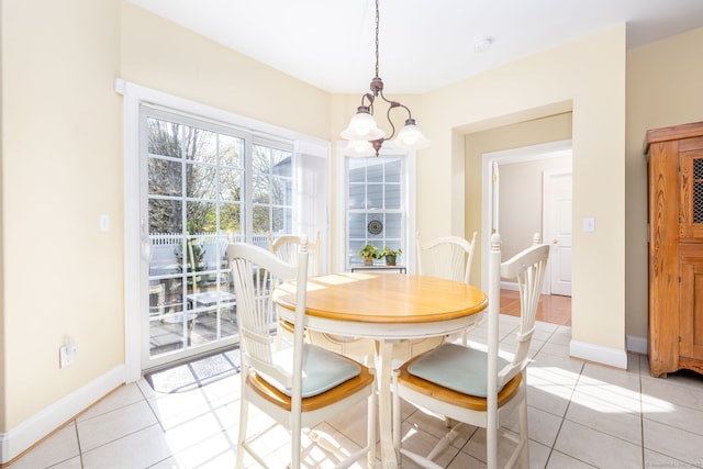 2 Pennington Dr Unit 2, Simsbury, CT 06070 - dining space with a chandelier, light tile patterned floors, and baseboards
