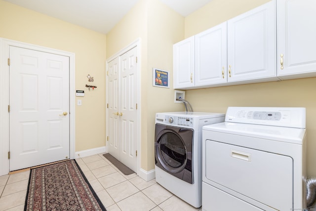 2 Pennington Dr Unit 2, Simsbury, CT 06070 - laundry area with cabinet space, separate washer and dryer, light tile patterned flooring, and baseboards