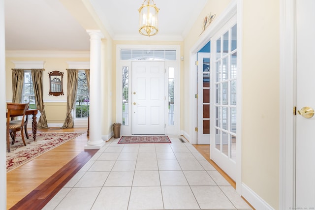 2 Pennington Dr Unit 2, Simsbury, CT 06070 - foyer with a chandelier, crown molding, baseboards, ornate columns, and light tile patterned floors
