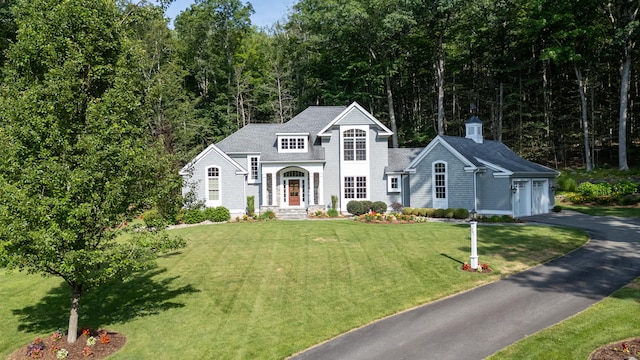 301 Fox Hopyard Rd, East Haddam, CT 06423 - view of front of property featuring driveway, a front yard, a garage, and roof with shingles