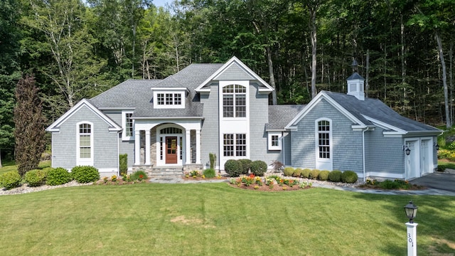 301 Fox Hopyard Rd, East Haddam, CT 06423 - view of front of property with a front yard, roof with shingles, and asphalt driveway