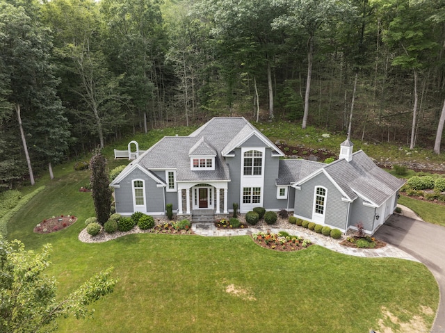 301 Fox Hopyard Rd, East Haddam, CT 06423 - view of front of home featuring concrete driveway, a shingled roof, a front lawn, a view of trees, and a garage