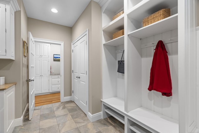 301 Fox Hopyard Rd, East Haddam, CT 06423 - mudroom featuring light stone finish floors and recessed lighting