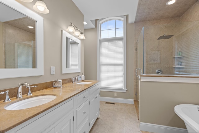 301 Fox Hopyard Rd, East Haddam, CT 06423 - full bath with a shower stall, double vanity, a freestanding tub, tile patterned floors, and recessed lighting