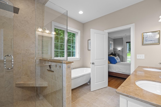 301 Fox Hopyard Rd, East Haddam, CT 06423 - bathroom featuring double vanity, a shower stall, a soaking tub, connected bathroom, and tile patterned floors