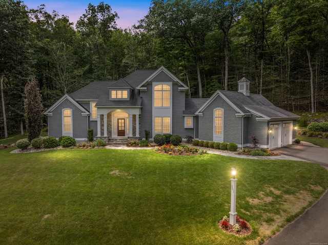 301 Fox Hopyard Rd, East Haddam, CT 06423 - traditional home featuring concrete driveway, a garage, a front yard, and a shingled roof
