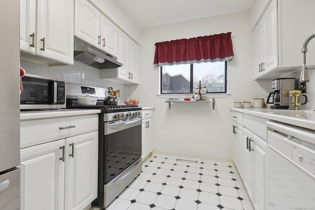 kitchen with under cabinet range hood, light floors, white cabinets, and stainless steel appliances