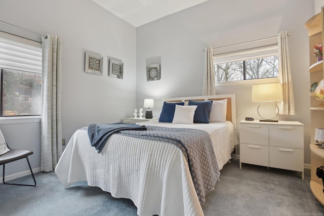 carpeted bedroom featuring baseboards