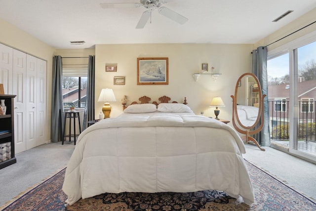 carpeted bedroom featuring visible vents, access to exterior, and ceiling fan