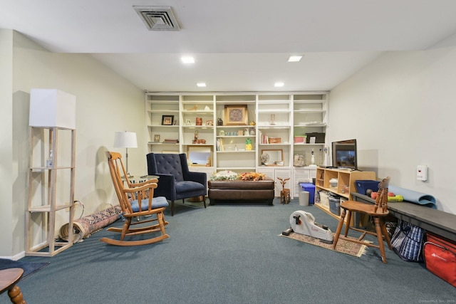 living area featuring recessed lighting, visible vents, and carpet floors