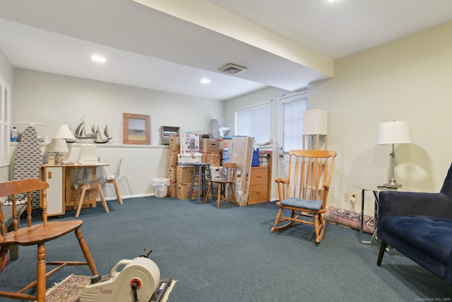 living area with recessed lighting, carpet flooring, visible vents, and baseboards