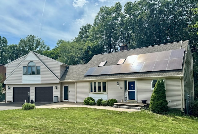 26 Lochview Dr, Windsor, CT 06095 - view of front of home with a garage, driveway, solar panels, a front lawn, and a chimney