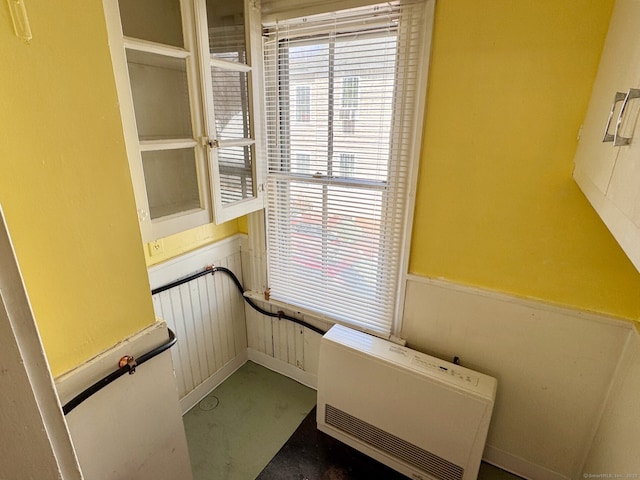interior space with heating unit and wainscoting