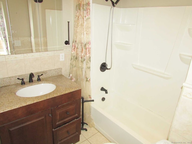 bathroom with shower / bathtub combination with curtain, vanity, tile walls, backsplash, and tile patterned floors