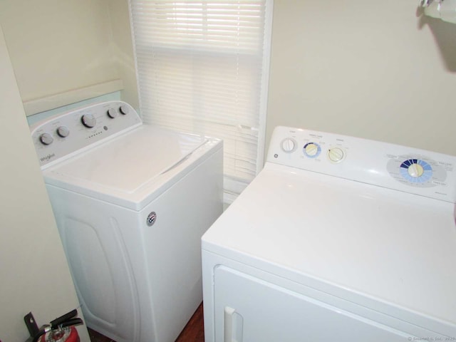 laundry room featuring washer and dryer and laundry area