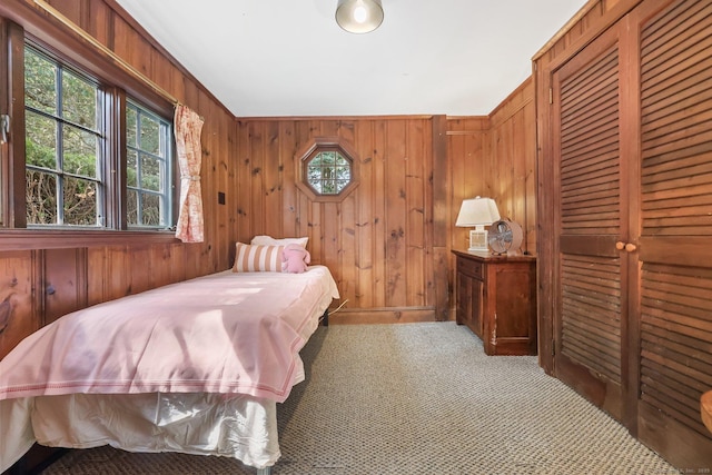 7 Ford Rd, Newtown, CT 06482 - bedroom featuring carpet floors, multiple windows, wooden walls, and a closet