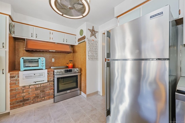 7 Ford Rd, Newtown, CT 06482 - kitchen featuring appliances with stainless steel finishes, light tile patterned floors, baseboards, white cabinets, and backsplash