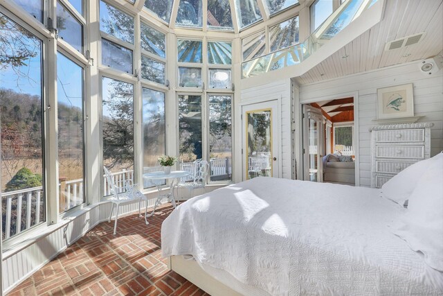7 Ford Rd, Newtown, CT 06482 - bedroom with multiple windows, brick floors, a high ceiling, and wooden walls