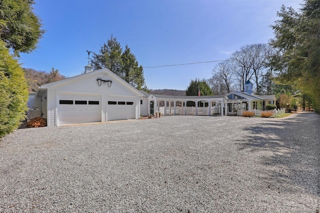 7 Ford Rd, Newtown, CT 06482 - view of front of property with an attached garage, driveway, and a chimney
