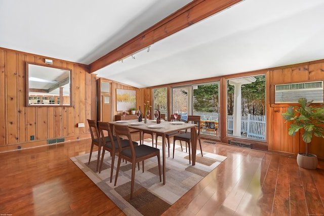 7 Ford Rd, Newtown, CT 06482 - dining area with wood-type flooring, lofted ceiling, an AC wall unit, and wooden walls