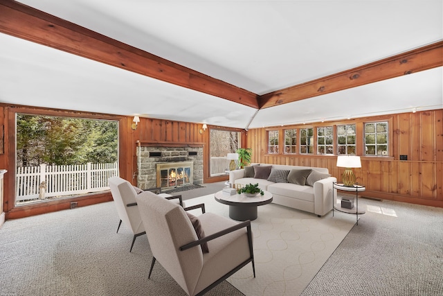 7 Ford Rd, Newtown, CT 06482 - living area featuring wood walls, plenty of natural light, carpet floors, and a stone fireplace