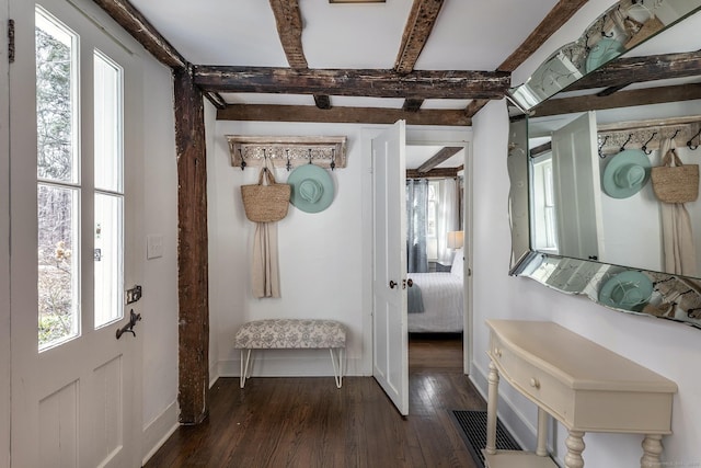 mudroom featuring dark wood-type flooring, baseboards, and beam ceiling