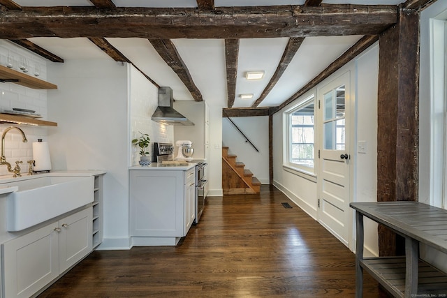 119 Town Hill Rd, Warren, CT 06754 - kitchen with open shelves, range with two ovens, wall chimney exhaust hood, decorative backsplash, and dark wood-style floors