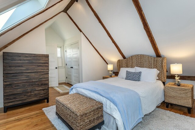 119 Town Hill Rd, Warren, CT 06754 - bedroom with wood finished floors, vaulted ceiling, a skylight, and baseboards