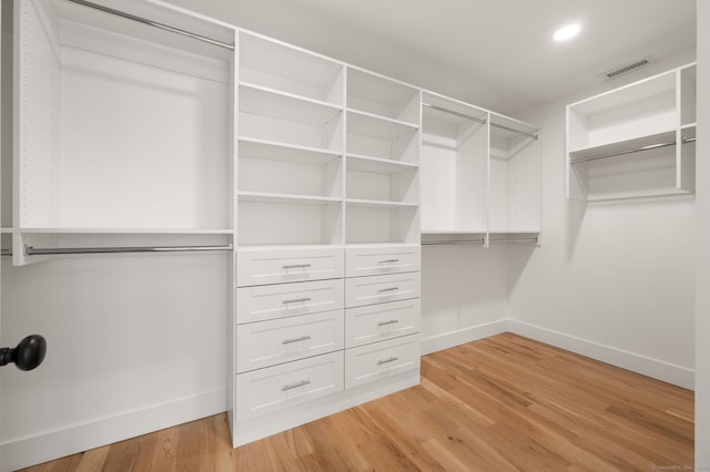 walk in closet featuring visible vents and light wood finished floors