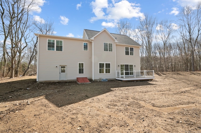 rear view of property with a wooden deck