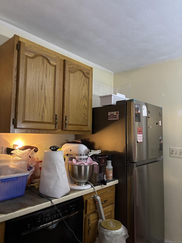 133 Traverse St, Waterbury, CT 06704 - kitchen featuring dishwasher, light countertops, and freestanding refrigerator