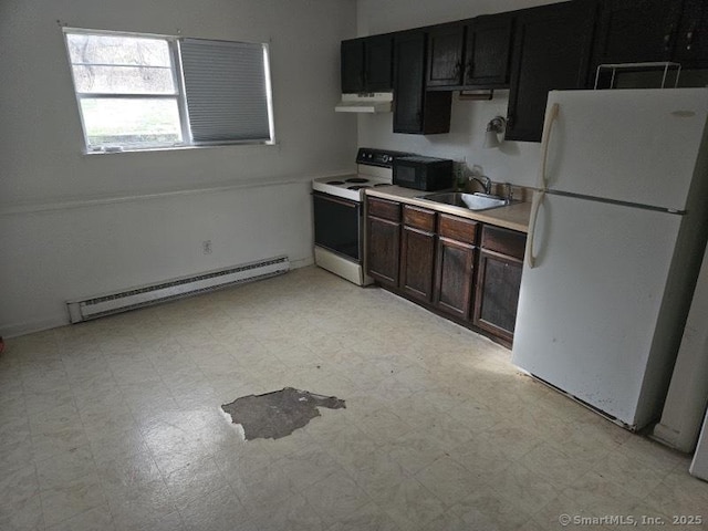 kitchen featuring white appliances, baseboard heating, light floors, under cabinet range hood, and a sink
