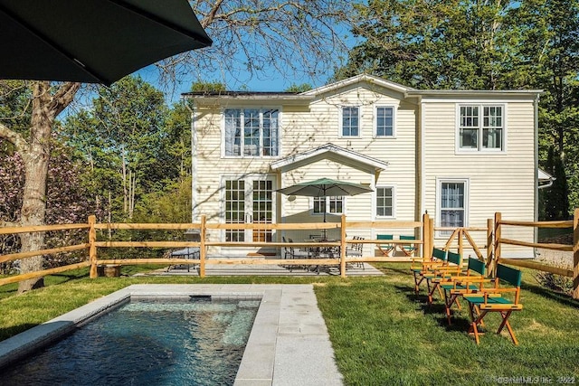 253 Tophet Rd, Roxbury, CT 06783 - rear view of house with a fenced backyard, an outdoor pool, and french doors