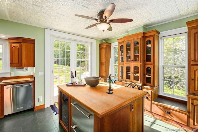 253 Tophet Rd, Roxbury, CT 06783 - dining area with ceiling fan, wine cooler, plenty of natural light, a desk, and an ornate ceiling