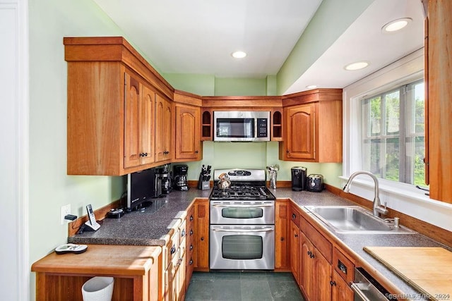 253 Tophet Rd, Roxbury, CT 06783 - kitchen featuring stainless steel appliances, brown cabinetry, recessed lighting, and dark countertops