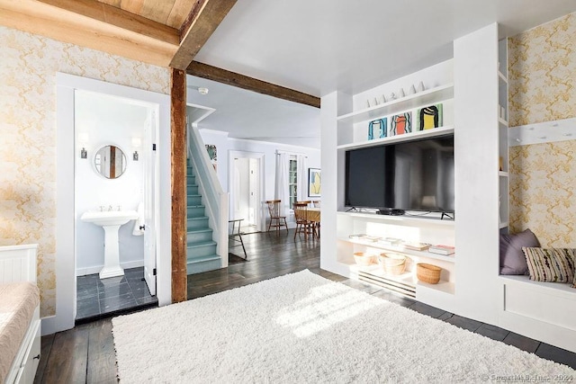 253 Tophet Rd, Roxbury, CT 06783 - bedroom with wallpapered walls, dark wood-style floors, beamed ceiling, and ensuite bath