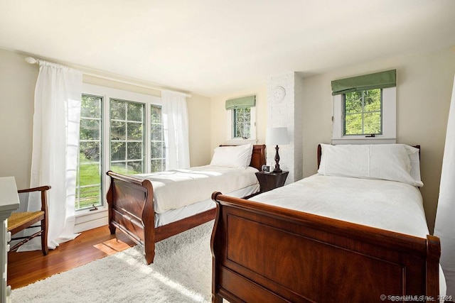253 Tophet Rd, Roxbury, CT 06783 - bedroom with wood finished floors and multiple windows