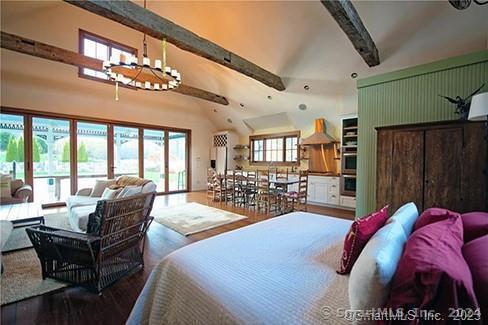 253 Tophet Rd, Roxbury, CT 06783 - bedroom featuring multiple windows, wood finished floors, beamed ceiling, and high vaulted ceiling