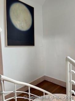 253 Tophet Rd, Roxbury, CT 06783 - stairs featuring wood finished floors and baseboards