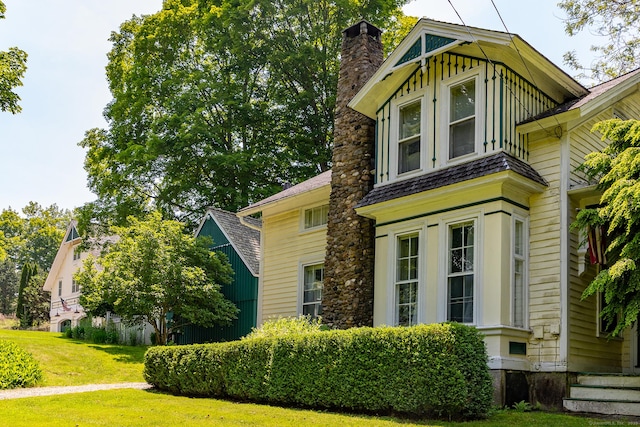 253 Tophet Rd, Roxbury, CT 06783 - view of front facade with a chimney and a front yard