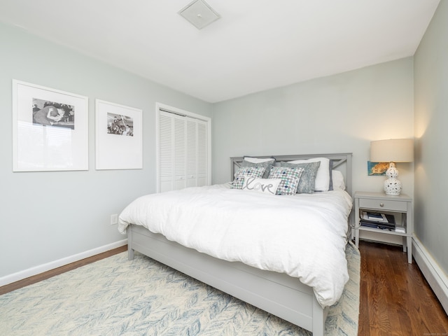 bedroom featuring wood finished floors and baseboards