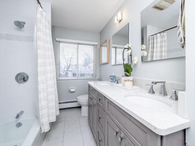 bathroom with baseboard heating, marble finish floor, a sink, and visible vents