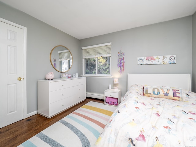 bedroom featuring a baseboard radiator, baseboards, and dark wood-style flooring